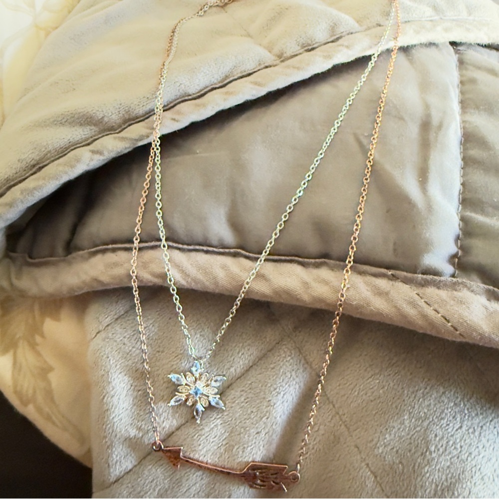 Snowflake necklace and arrow necklace both in very good condition hardly worn.